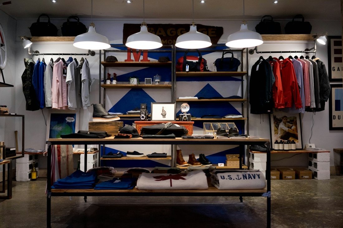 Fashion boutique interior with clothing racks and displays